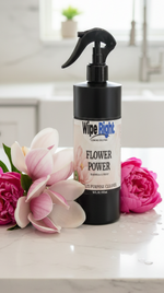 Wipe Right Flower Power cleaner bottle on a marble surface with flowers.